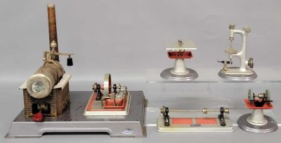 Wilesco steam engine and four stationary power tools. Power plant has been fired and has light 