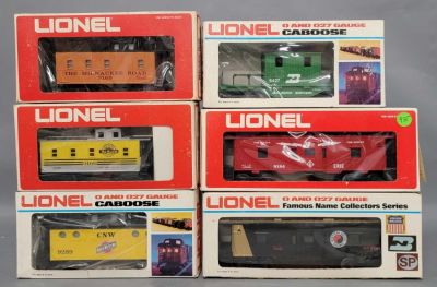 Six Lionel O gauge mixed group of Caboose in original boxes. Includes 9184 Erie Bay window 