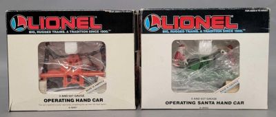 Two Lionel O gauge operating Hand cars in original boxes. Group includes 18403 Santa hand car 