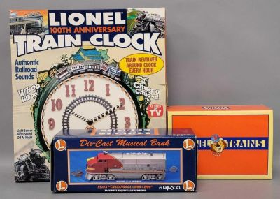 Group of three Lionel collectors items in original boxes. Includes an Enesco diecast Santa Fe 