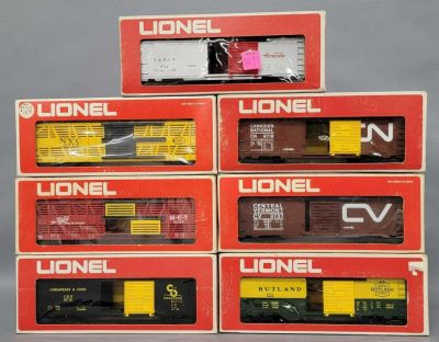 Seven Lionel O gauge mixed box cars in original boxes. Group of seven Lionel O gauge mixed box 