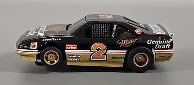 Scarce Tyco #2 Miller Genuine Draft Pontiac Grand Prix HO Slot Car without air dam. The car is 
