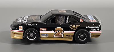 Tyco #2 Miller Genuine Draft Pontiac Grand Prix HO Slot Car with air dam. The car is in 