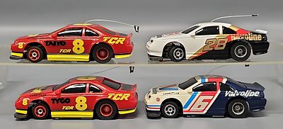 Four Tyco TCR HO Slotless Racing Cars to include two different TYCO #8 cars, Valvoline #6 and 