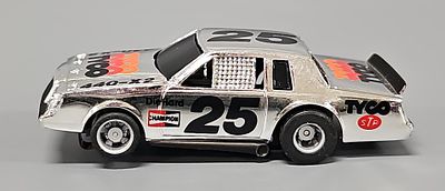 Tyco HO 440-X2 #25 Chrome Slot Car with gray rims, black racing numbers and TYCO STP logos. The 