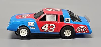 Scarce Tyco HO Richard Petty #43 STP Pontiac aerocoupe Slot Car. The car is in excellent to 