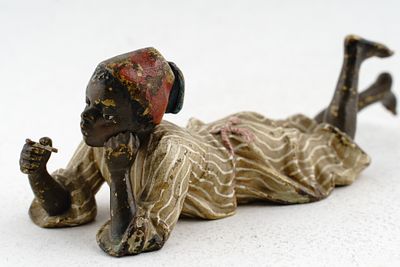 Скульптура "Мальчик с кофе" Вена, Фабрика Бергмана, нач. ХХ века. Бронза, роспись. 14,2х4,6х5 