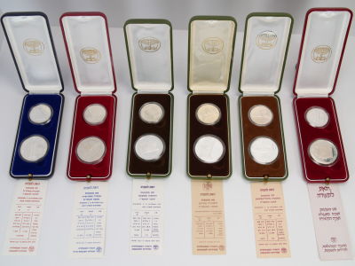 Lot of 6 boxex of Israeli offical Hanukka silver Coins. 850 silver, two coins in each box: 14.4 