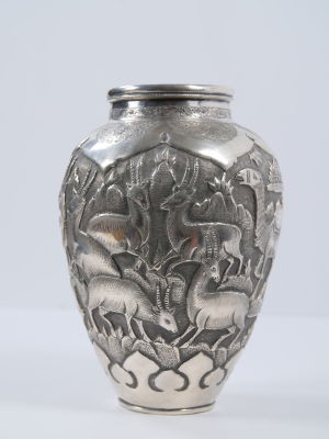 Persian silver vase, embossed with figures of animals and Persian architechture. Height: 19.5cm 
