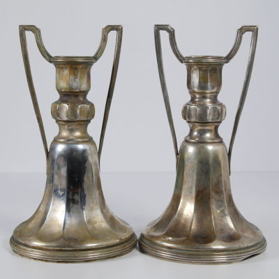 A pair of silver Art Deco style candlesticks. A pair of German Art Deco candlesticks. Defects. 