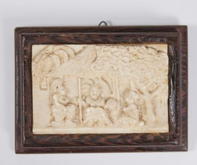 An ivory carved scene with a wooden frame. Signed, 5.5X8.5 frame not included