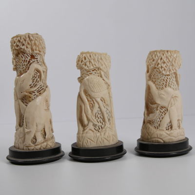 Three light fixtures sculpted in ivory. Without the lamps. Carved with animal and plant scenes. 