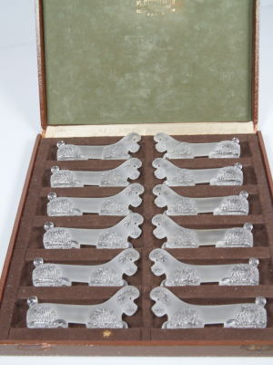 Art Deco Glass Knife Holders Set. A set of 12 glass poodle-shaped knife holders in Art Deco 
