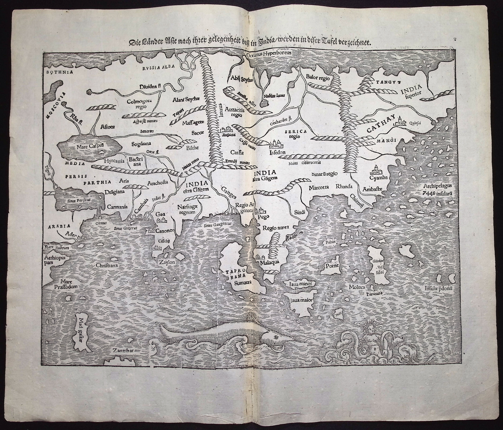 Munster, pub. 1574 - Map of India with Asia, Russia, some East Indies, Madagascar, Sea Monsters)