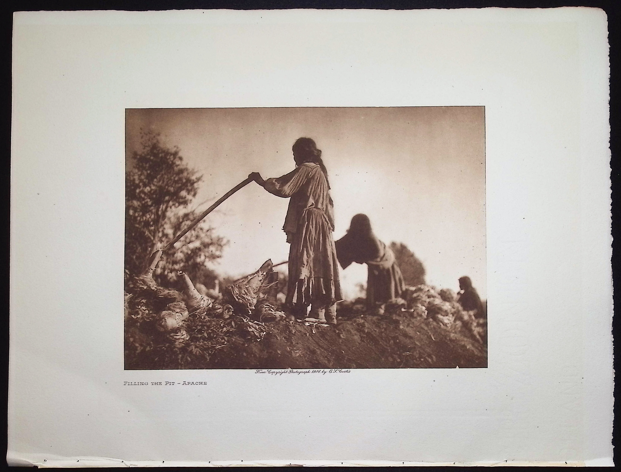 Edward Curtis - Filling the Pit - Apache