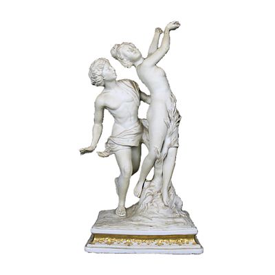 GRUPPO - GRUPPO in biscuit raffigurante Apollo e Dafne con lumeggiature in oro manifattura 