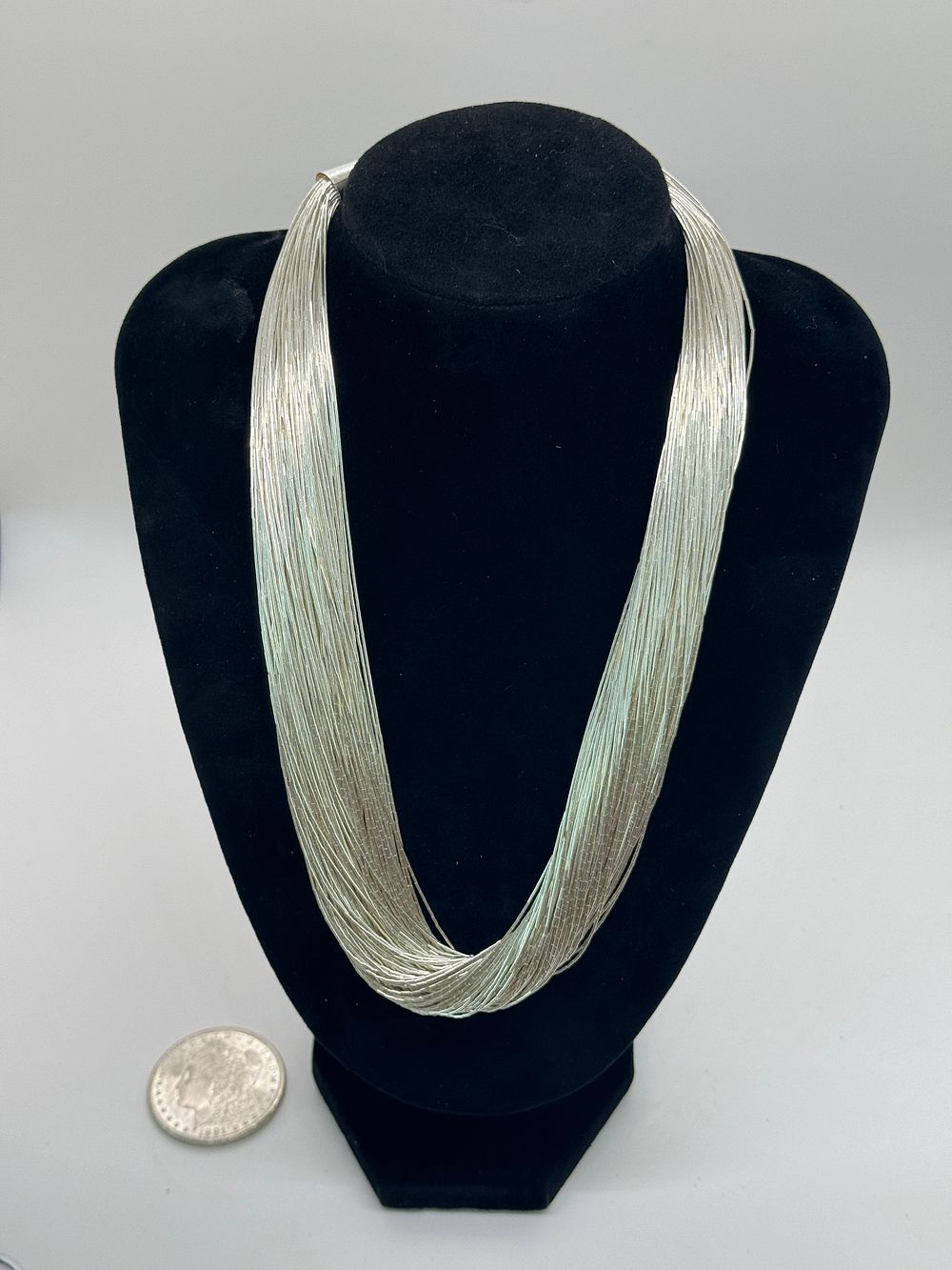 Lot 46: Stunning100 Strand Liquid Silver Necklace