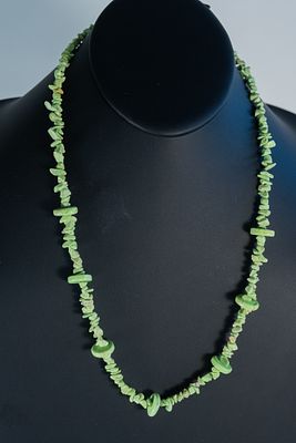 Rare Gaspeite Necklace. Rare Austrailian AAAAA Gaspeite necklace featuring chips and 13mm disks. 