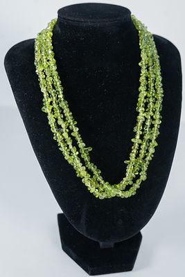 Beautiful Three Strand Peridot Necklace. Beautiful (3) strand necklace featuring AAAA center 