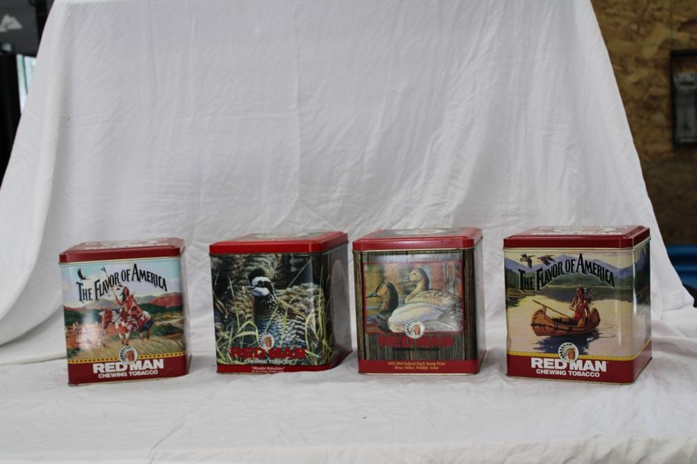 Lot 256: RED MAN TINS
