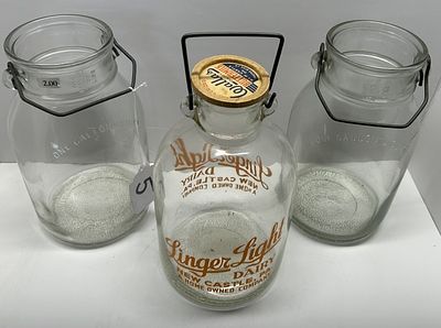 1 - GLASS ONE GALLON JAR. CLEAR GLASS, THREE ANTIQUE ONE GALLON JARS WITH METAL HANDLE, ONE WITH LID