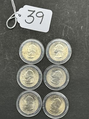 1 - QUARTER DOLLARS IN CASE. 6 COINS, 2010, DIFFERENT LOCATIONS ON BACK