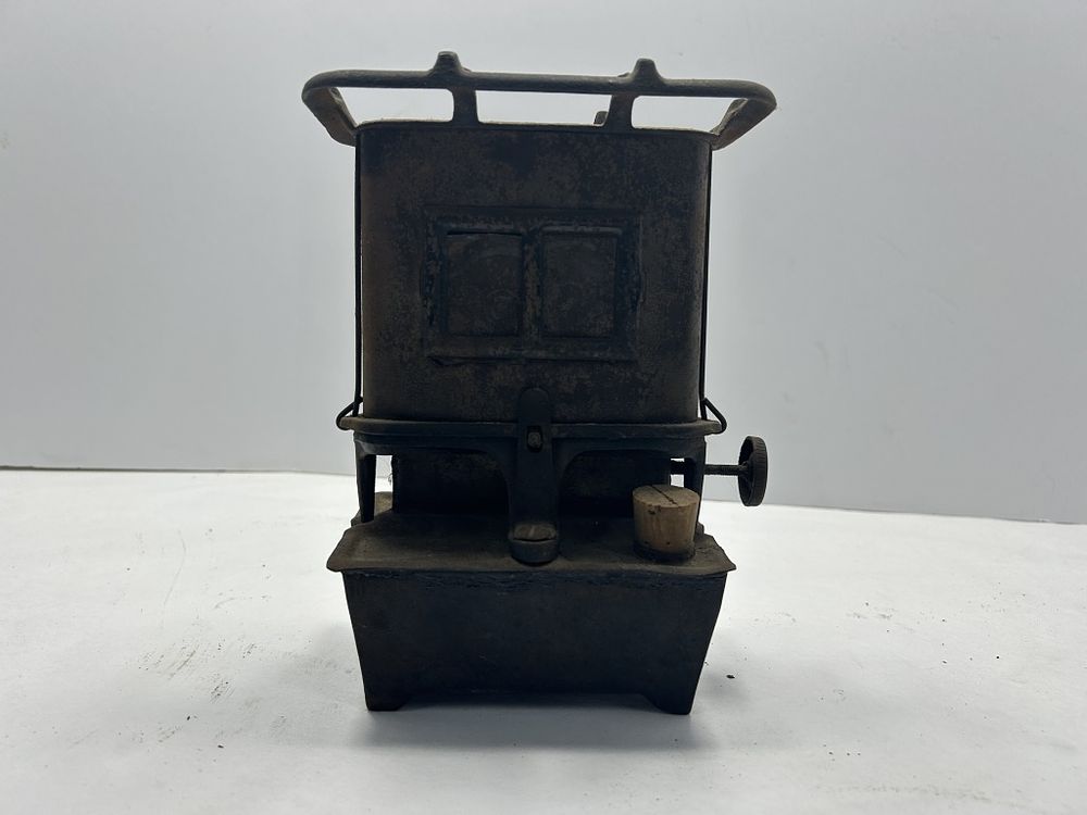Lot 246: ANTIQUE SAD IRON HEATER