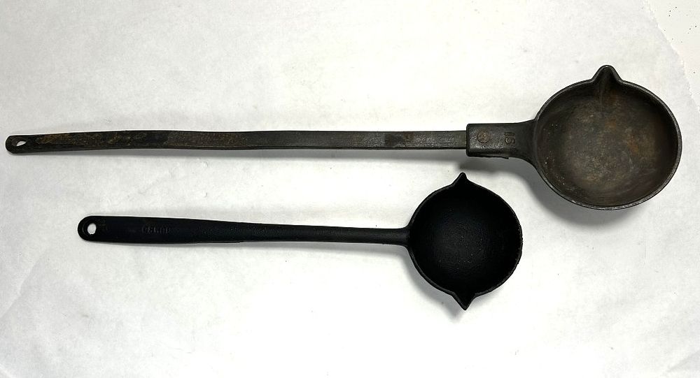 Lot 277: (2) CAST IRON SOUP LADLES