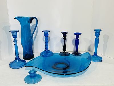 LOADED LOT OF BLUE GLASS. BLUE GLASS SERVING TRAY, CANDLE STICKS AND PITCHER