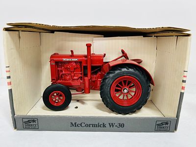SPEC CAST 1/16 MCCORMICK W-30 TRACTOR. DIECAST, ON RUBBER, STOCK #ZJD734