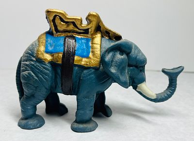 Painted Cast Iron Elephant Bank with Howdah. A vintage-style painted cast iron bank modeled in 