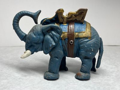 Mechanical Elephant with Howdah Pull Tail Bank. This item is a mechanical bank in the style of 