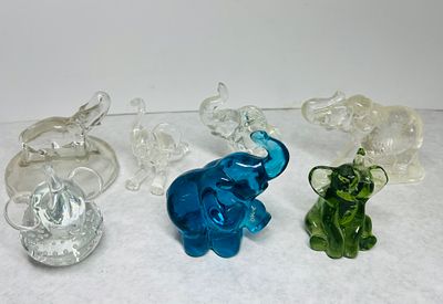 Glass Elephant Figurines. A collection of assorted glass elephant figurines in various sizes 