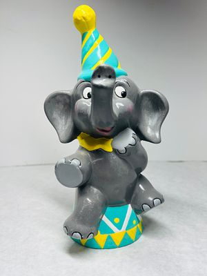 Hand-Painted Ceramic Circus Elephant Coin Bank. This hand-painted ceramic coin bank is shaped as 