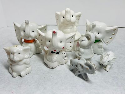 Vintage Glazed Ceramic Elephant Figurines. A collection of vintage glazed ceramic elephant 