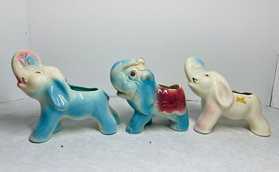 Vintage Ceramic Elephant Planters. A trio of vintage ceramic elephant-shaped planters, in the 