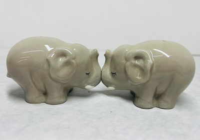 Kissing Elephant Salt and Pepper Shakers. A pair of novelty ceramic salt and pepper shakers in 