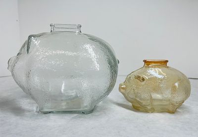 Two Glass Piggy Banks Anchor Hocking. Two glass piggy banks attributed to Anchor Hocking 