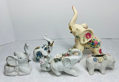 Vintage Porcelain and Ceramic Elephant Figurines. A group of vintage ceramic and porcelain 