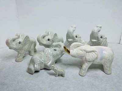 Lusterware Ceramic Elephant Figurines. An assortment of vintage ceramic elephant figurines, each 