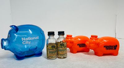 Promotional Plastic Piggy Banks and Vintage Elephant Brand Flavor Bottles. A collection of 