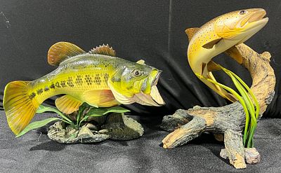 A Collection of Fish Sculptures. A collection of various fishing-themed decorative items 