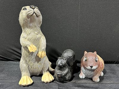 Molded Resin Wildlife Figurines. A trio of decorative wildlife figurines crafted from molded resin.