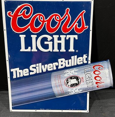 Coors Light The Silver Bullet Advertising Sign. A vintage embossed advertising sign for Coors 