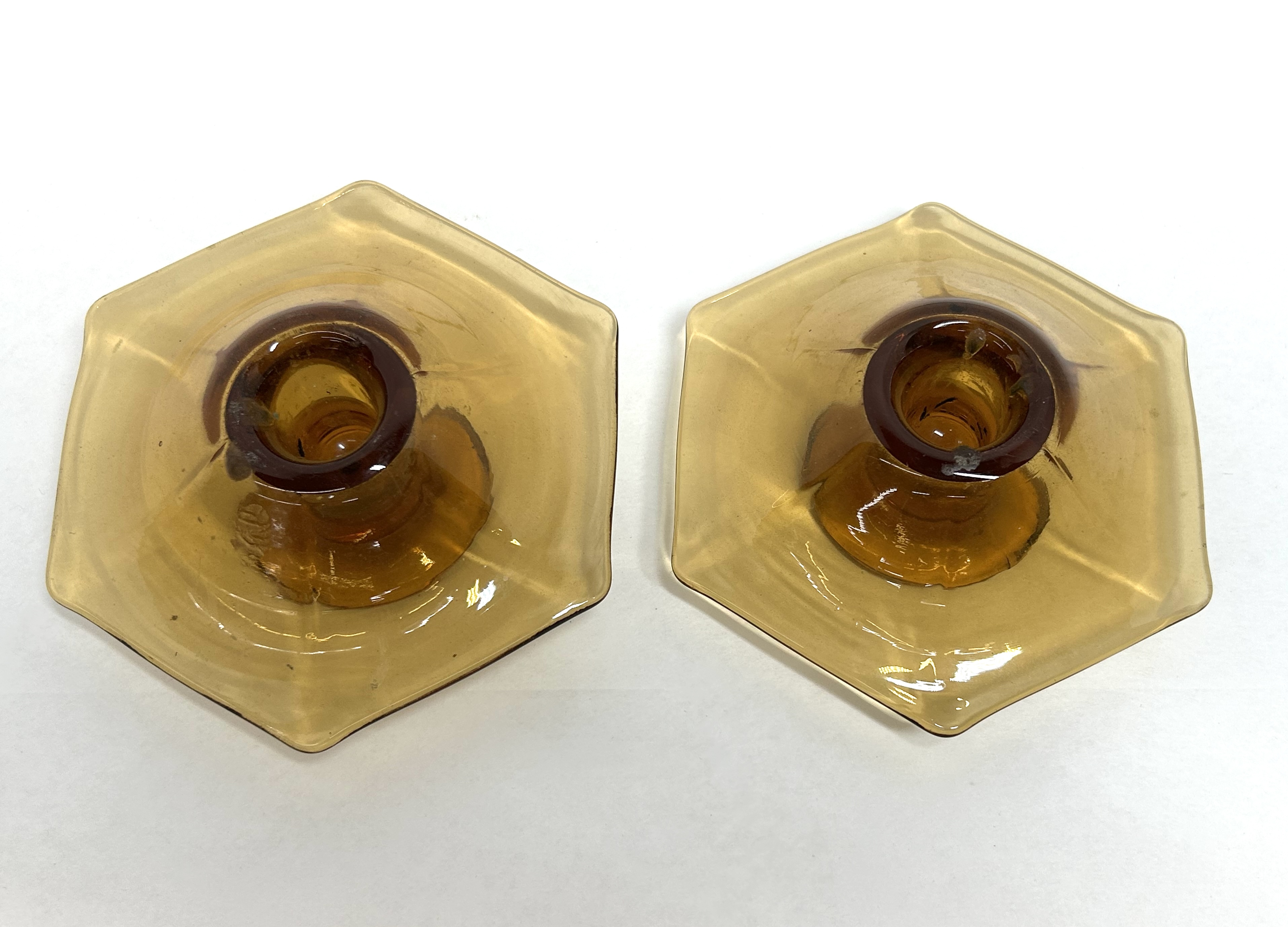 PAIR OF AMBER GLASS CANDLESTICKS