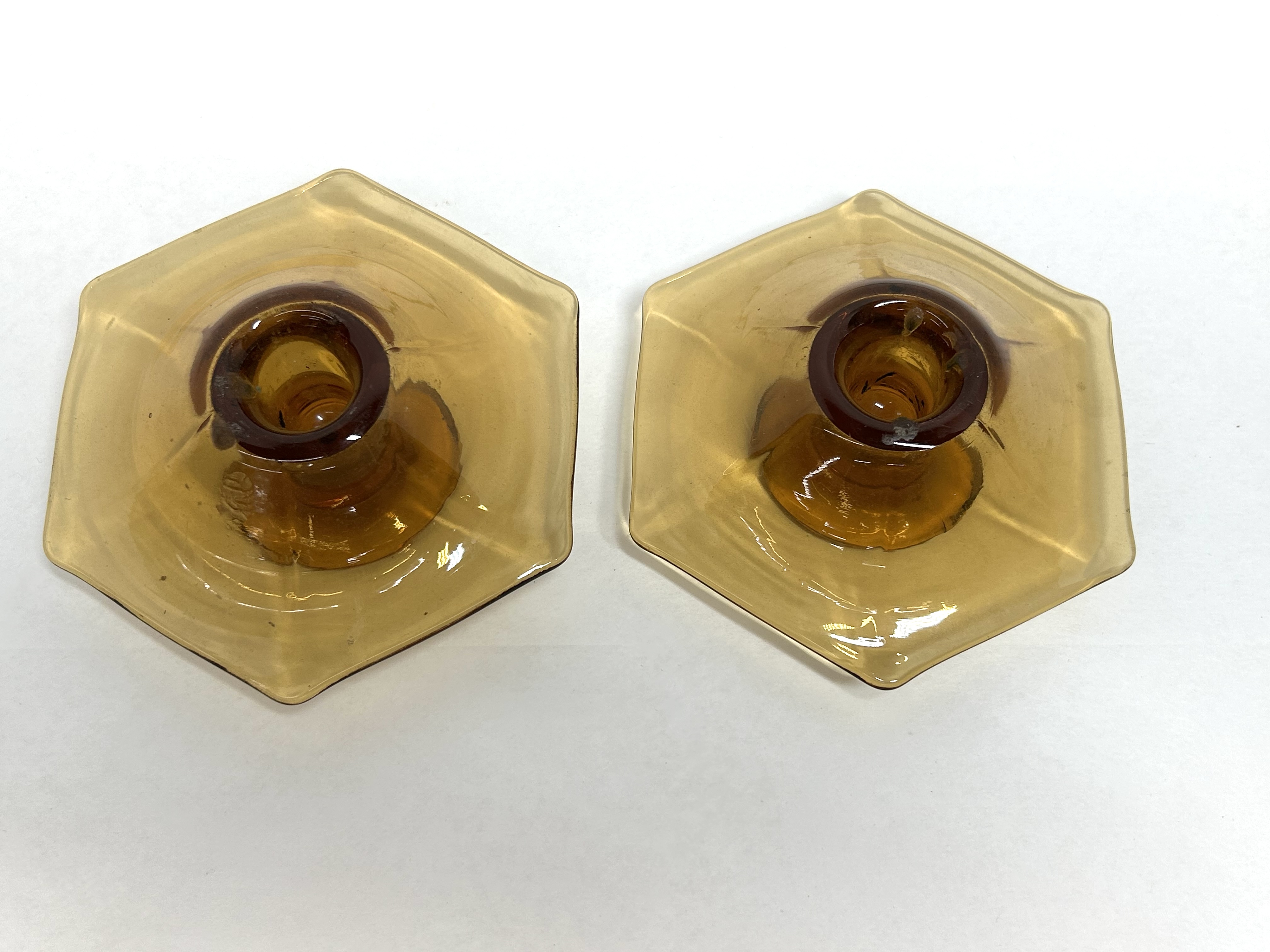 PAIR OF AMBER GLASS CANDLESTICKS