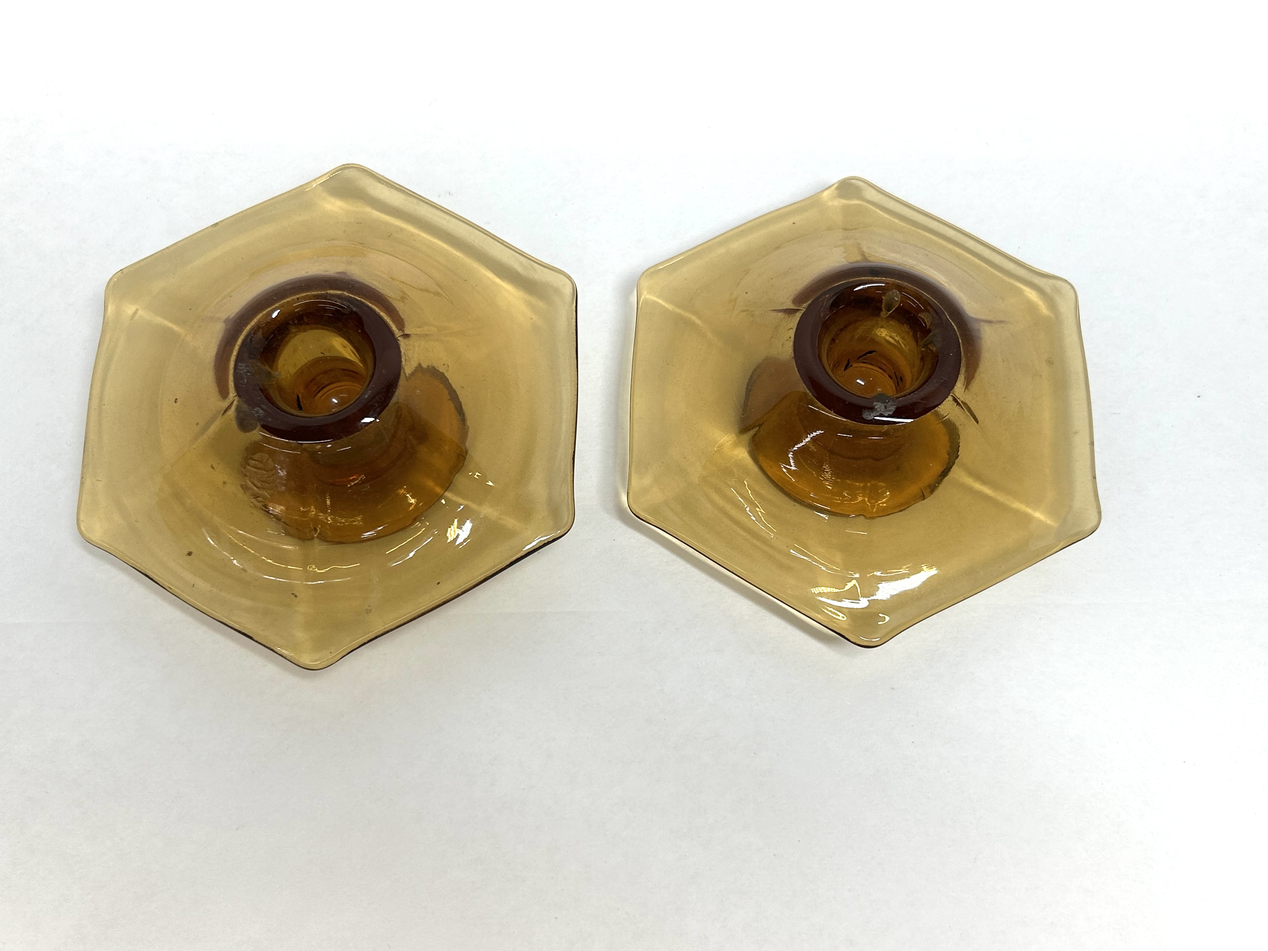PAIR OF AMBER GLASS CANDLESTICKS