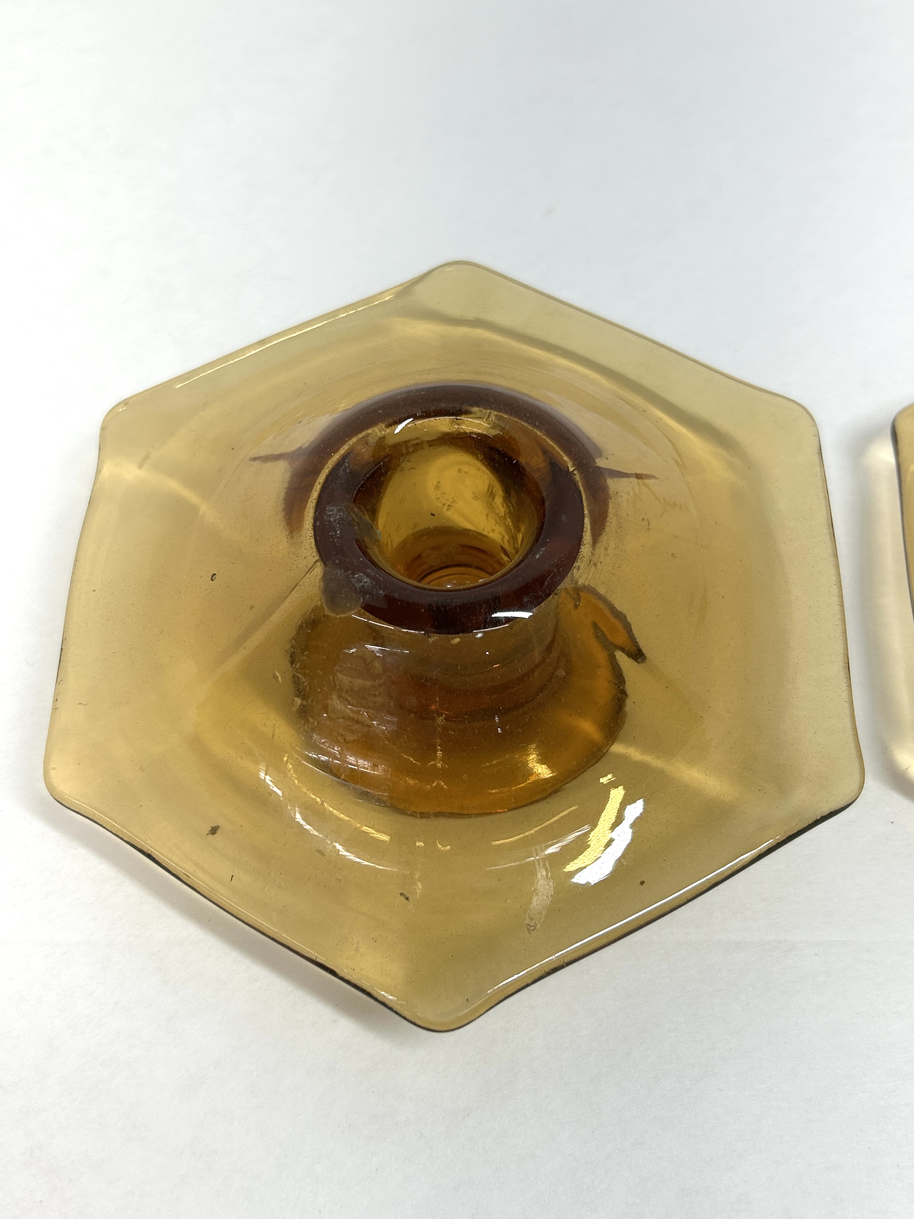 PAIR OF AMBER GLASS CANDLESTICKS