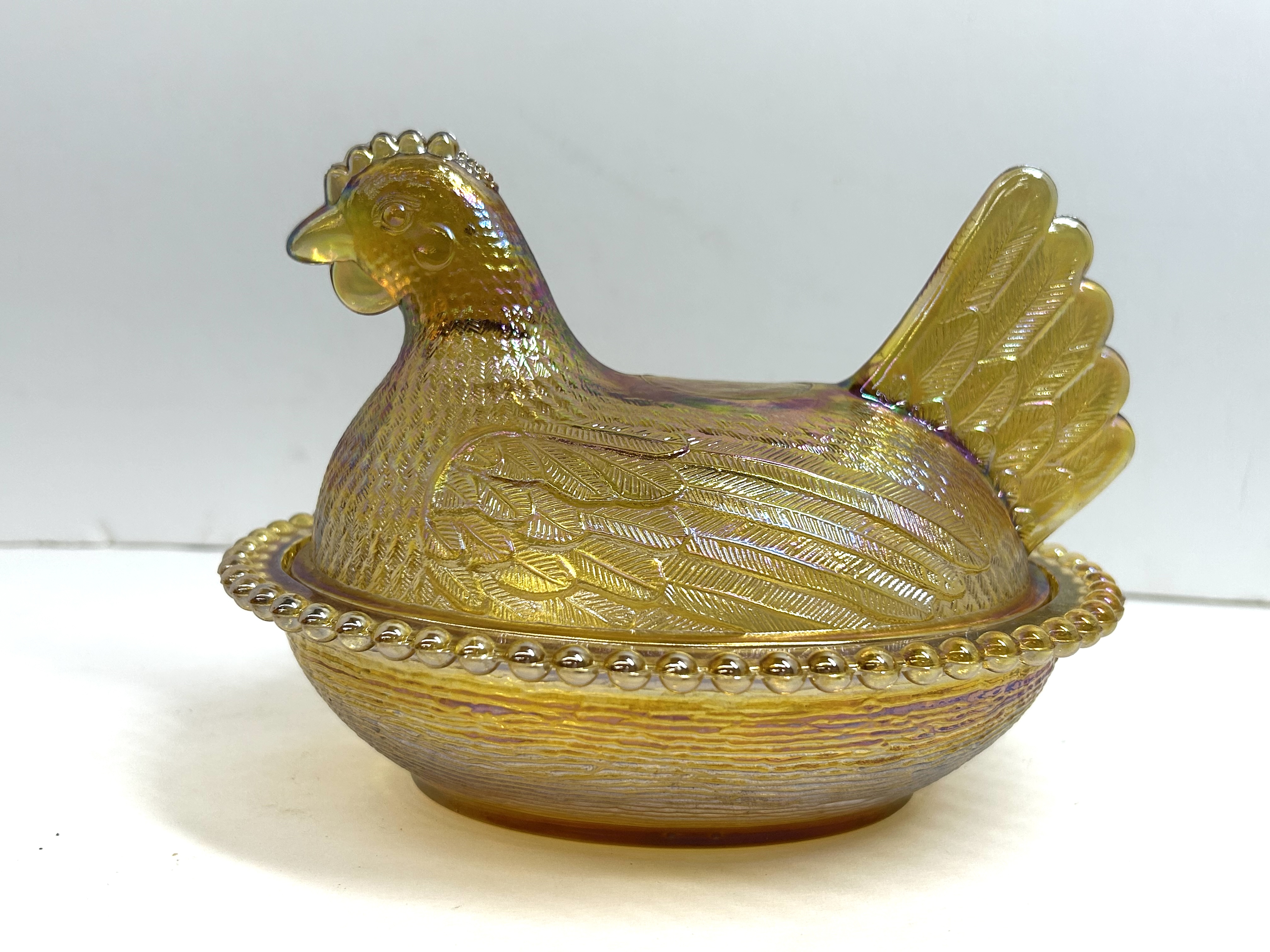 MARIGOLD IRIDESCENT GLASS HEN ON NEST DISH