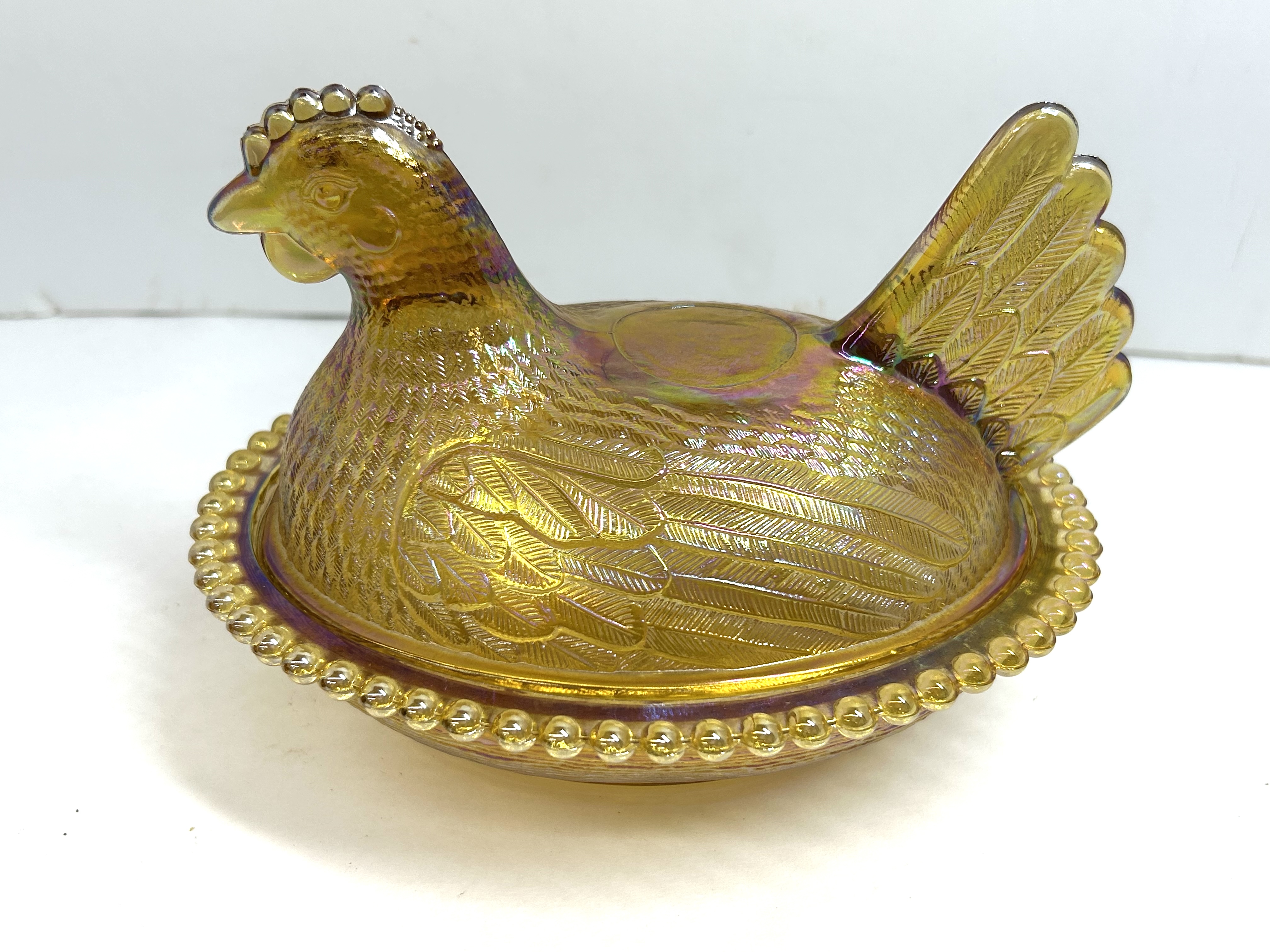 MARIGOLD IRIDESCENT GLASS HEN ON NEST DISH